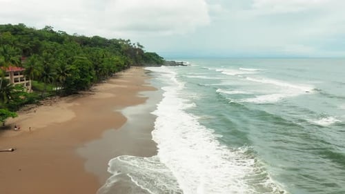 4K Aerial Drone shot of Tambor Empty Beach in Costa Rica.
Low Altitude Angle. Dramatic Weather with