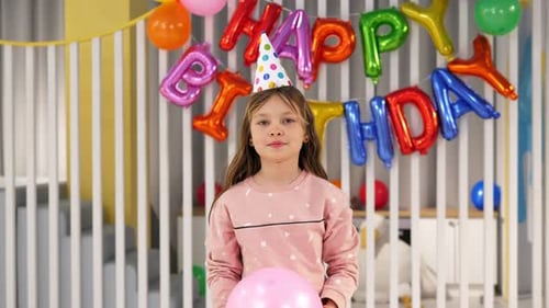 Girl with Pink Balloon at Birthday Celebration