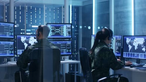 Cybersecurity Team Monitoring Global Network Data in Office