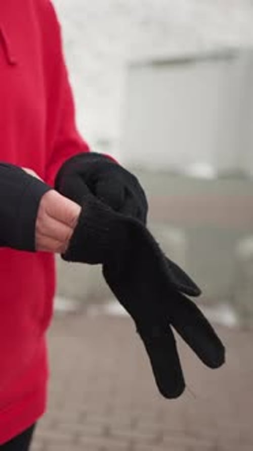 Putting On Gloves in Cold Weather