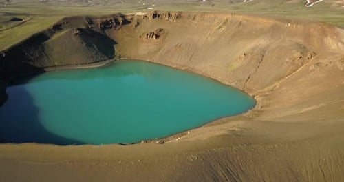 Aerial view of small volcanic Krafla lake with azure water, Iceland