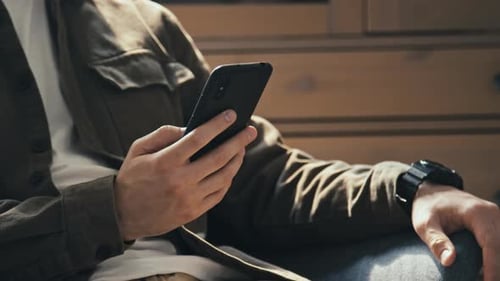 Man Using Phone and Pressing Lock Button