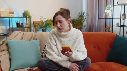 Woman Crying After Receiving Bad News On Her Phone