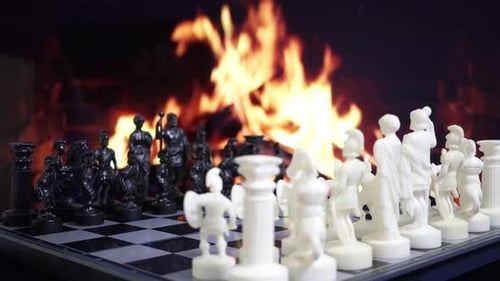 Chess Game Prepared to Start with Fireplace Background