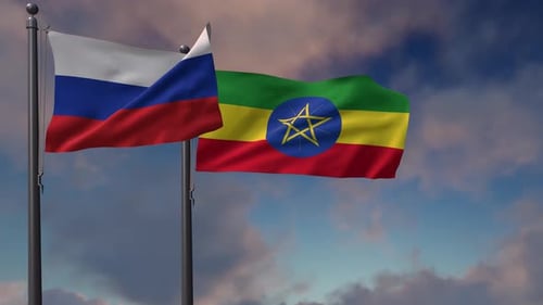Waving Flags of Russia and Ethiopia Together Against Cloudy Sky