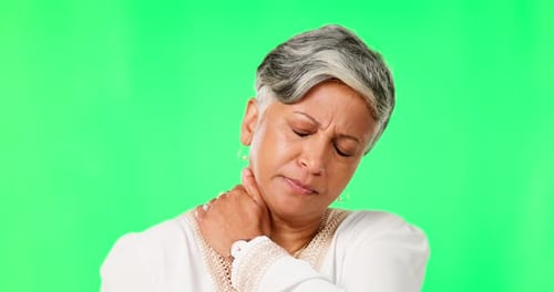 Mature, woman and neck pain, green screen and muscle tension, inflammation