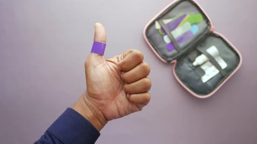 Bandage on Thumb Gives Thumbs Up by First Aid