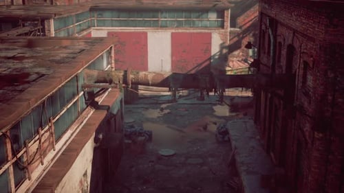 Abandoned Factory Site with Collapsing Structures and Old Brick Buildings