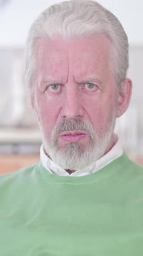 Senior Man Experiencing Headache and Discomfort