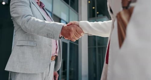 Closeup, handshake and business people in city, partnership and agreement with thank you