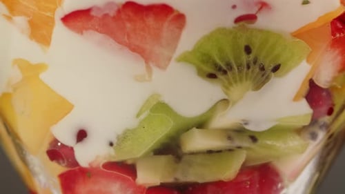 Close Up of Colorful Fruit Salad with Cream