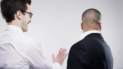 Fight, comic and business men slapping, work communication and funny against a white studio