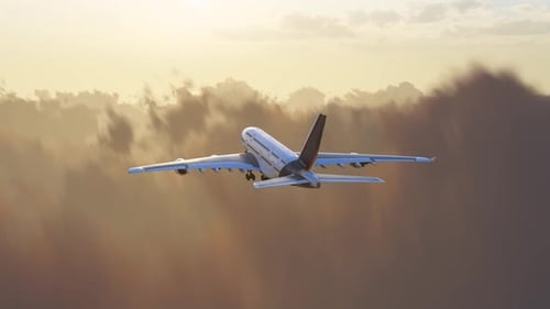 The Plane Flew Into The Distance Above The Clouds.