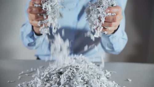 Shredded Paper Office Documents in Worker Woman Hands Close Up