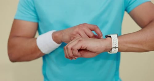 Person Taps Smart Watch During Workout