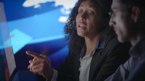 Engaging in a Dynamic Business Discussion Set Within a Contemporary Office Environment