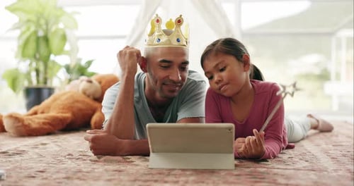 Girl and Dad Playing Together on Tablet at Home