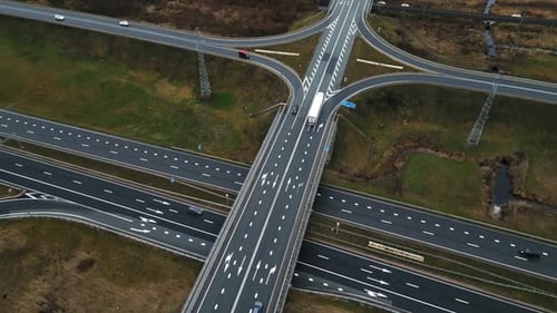 An Aerial View of a Busy Highway Interchange Captured in Real Time From Above Showcasing the Traffic
