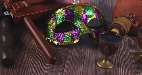 Purim Still Life with Mask, Noisemaker, Wine