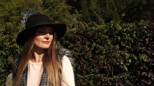 Fashion Woman Relaxing In Park