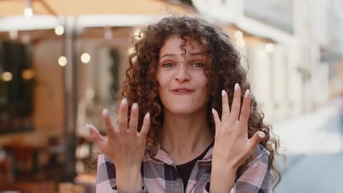 Young Woman Looking Surprised at Camera Shocked By Sudden Win Good Victory News Wow in City Street