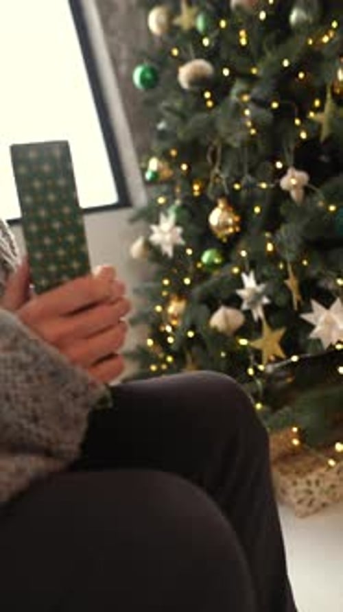 Loving Couple Exchanging Christmas Gifts at Home
