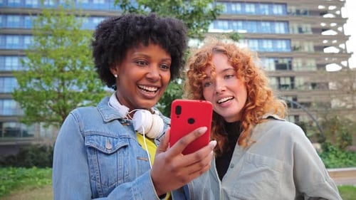 Two Happy Young Women Video Chatting on Smartphone