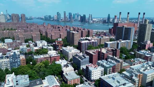 Drone aerial landscape of apartment blocks residential units housing city streets Manhattan skyline