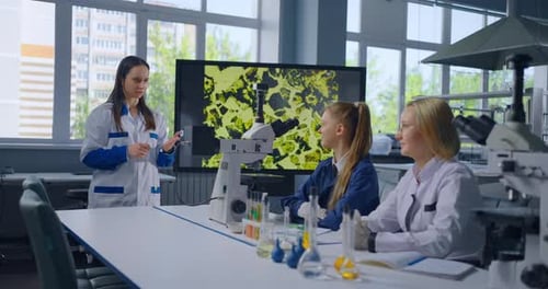 Studying Chemistry In Modern High School Woman And Teens Girls Students In Classroom