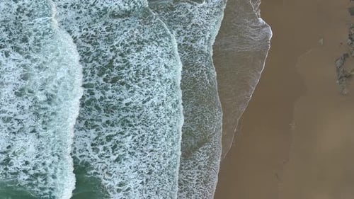 Waves Rolling On Sandy Beach In Slow Motion - Aerial Drone