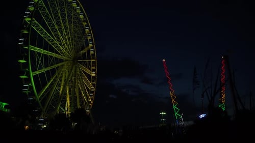 Illuminated amusement park at night