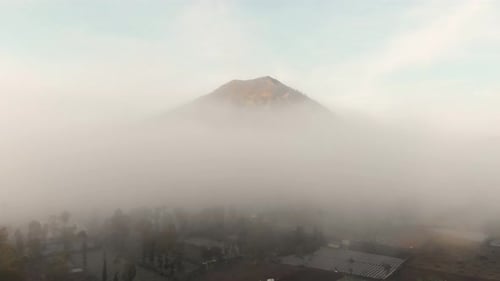 Aerial view of mount Batur in early morning with low clouds, Bali, Indonesia