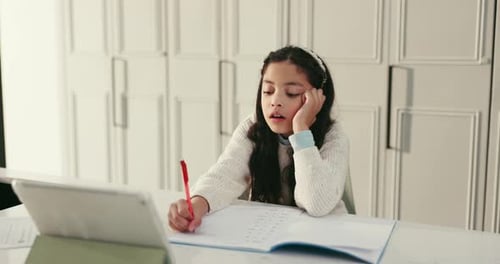 Kid, student and tired with writing in home, tablet for online education or bored with curriculum