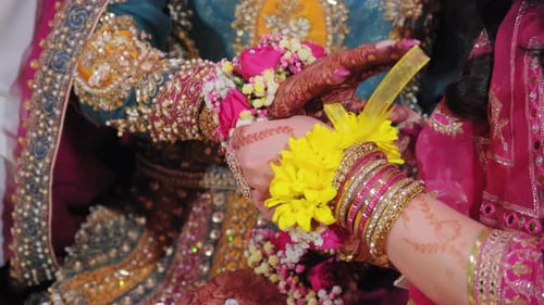 Hands Clasped Together at an Elegant Wedding Celebration