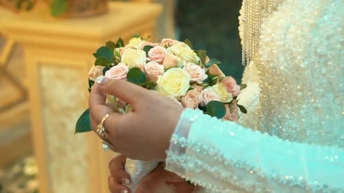 Bride Holds Wedding Bouquet Close Up
