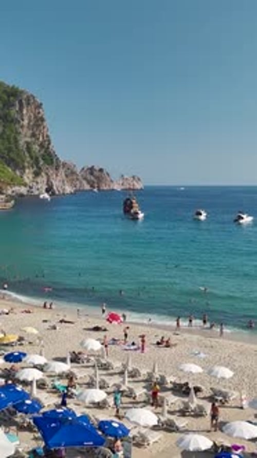 Aerial View of Beach Coastline with People