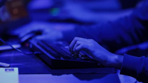 Playing Online Games in Blue Lighting at Competition