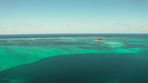 Tropical Guyam Island with a Sandy Beach and Tourists