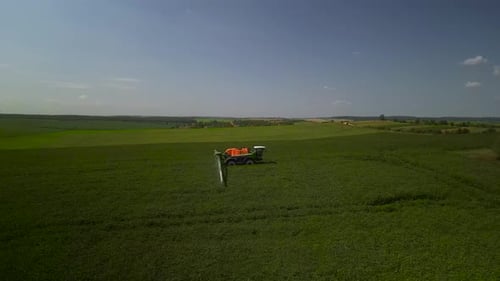 Spray Fertilize On Field With Chemicals In Agriculture Field