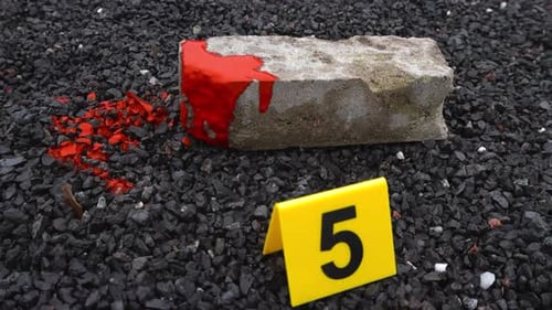 Crime Scene Evidence with Brick and Marker