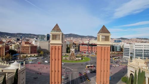 A long Panoramic aerial drone view of city traffic Plaza de Espana of Squares with Venetian Towers