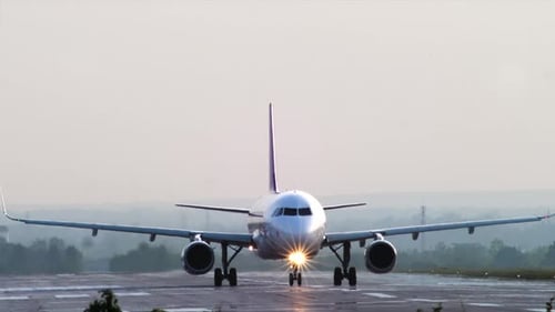 Airplane moving on the runway preparing for take off. Airbus A320 taxi on runway.