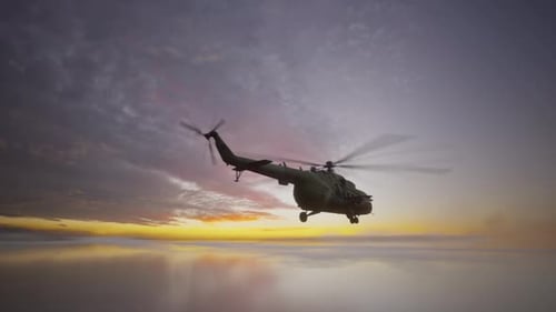 Military Helicopter Flying Over Calm Water at Sunset