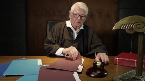 Judge in court talking Court room scene - modern lawyers in an american trial court in front of a ju