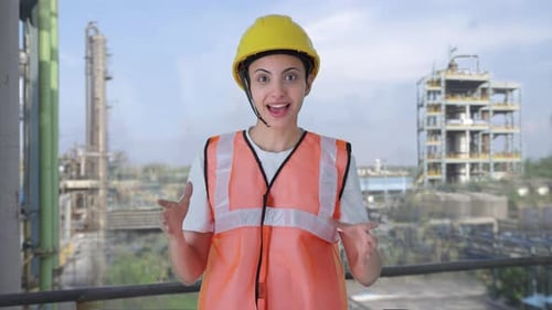 Female Engineer Explains Plant Operations in Industrial Setting