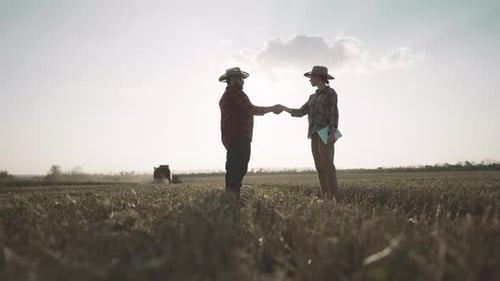 Farmers Handshake in a Field at Daytime