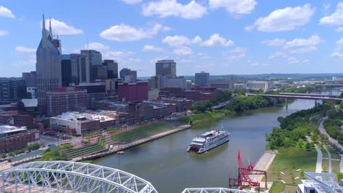 Nashville, TN / April 5, 2016: Ferry Heading Up Nashville River, Cityscape