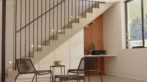 Stylish Interior with Modern Staircase and Lounge Chairs