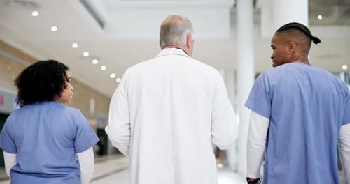 Doctor team, talking and healthcare conversation with planning in hospital of medical group