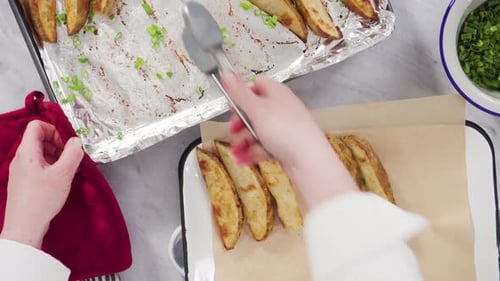 Arranging Golden Potato Wedges for Serving